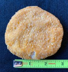 Figure 2. Chicken patty with coating missing but less than half inch so has no defect.