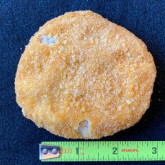 Figure 3. Chicken patty with two breading voids each less than half an inch so there is no defect.